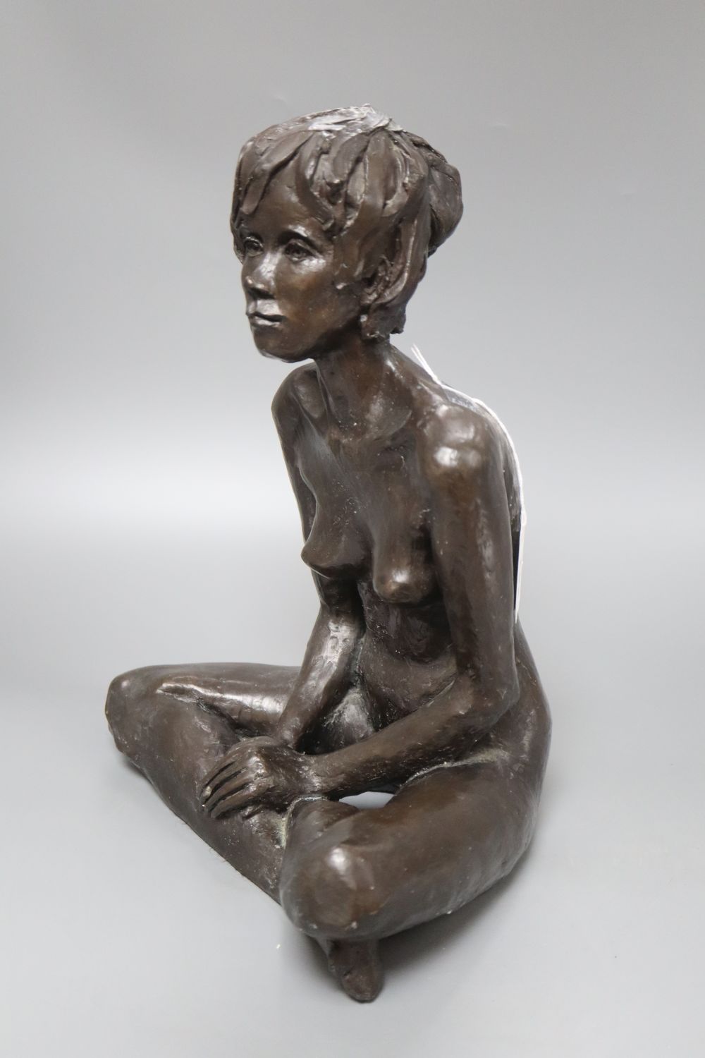A modern bronzed resin model of a nude Mona, 32cm high